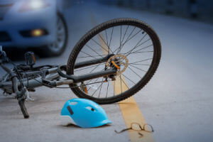 bicycle versus car accident at night