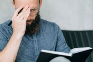 injured man holding head