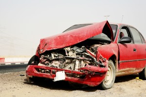 red car with frontal collision damage
