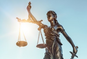 image of scales of justice against the sky