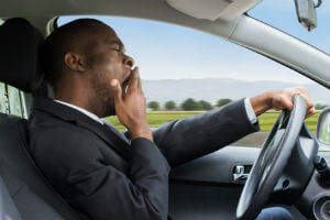 yawning-man-driving-fatigued