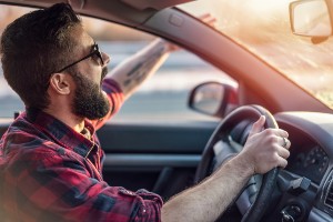 young man shouting through open car window